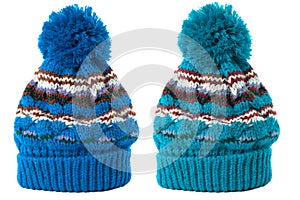 Two blue winter knit ski hat isolated white