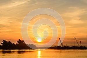 Two boats docking early in the morning near the pier. Horizontal