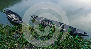 Two boats in the lake shore