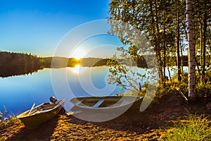 Two boats on a lake shore