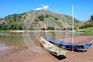 Two boats on the river bank