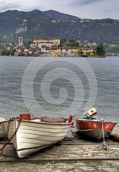 Two boats on the shore of lake Orta