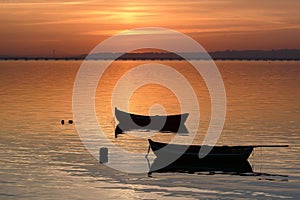 Two boats at sunset