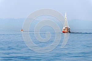 Two boats travelling away