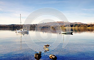 Two boats on Windermere with mountain backdrop