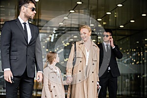 two bodyguards protecting successful woman and photo