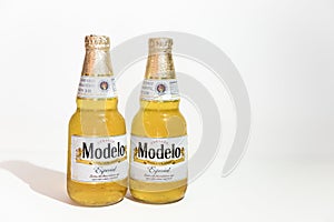 Two bottle of Modelo on a white background.