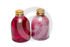 two bottles bath salt golden white background