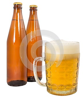 Two bottles of beer and a full beer mug