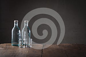 Two bottles of beverage on a counter top
