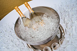 two bottles of champagne in a bucket of ice. cooling of alcoholic beverages