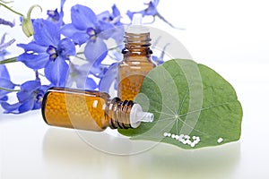 Two bottles with homeopathy globules