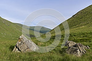 Two Boulders, possibly Glacial Erratics lie at the Head of the Valley in Glen Doll, part of the Cairngorm National Park.