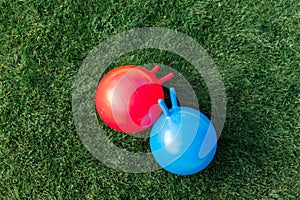 two bouncing balls or hoppers on grass