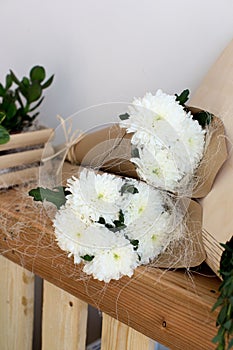 Two bouquets of white chrysanthemums