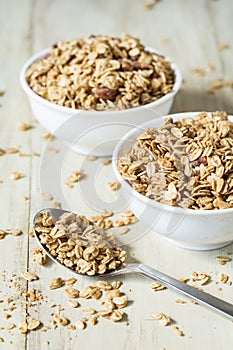 Two Bowls of Almond Granola With Spoon Vertical