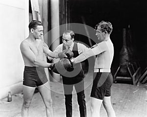 Two boxers and a referee