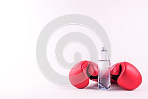 Two boxing gloves and a bottle of water. Ready for a workout photo