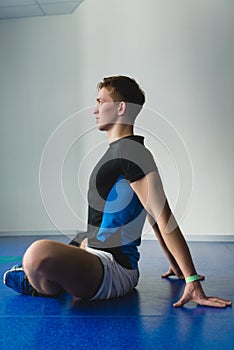 Two boxing men exercising together at the health club