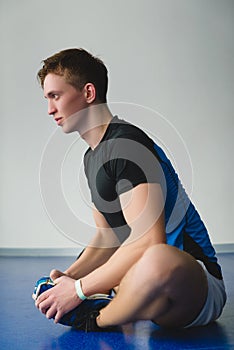 Two boxing men exercising together at the health club