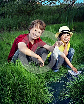 Two boy play in stream