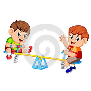 Two boy playing on seesaw