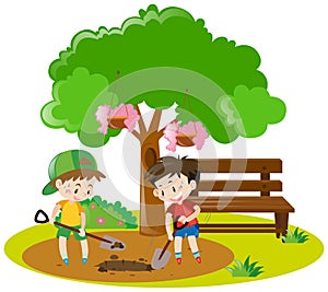 Two boys digging hole in garden