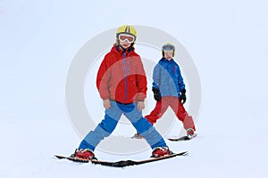 Two boys enjoying winter ski vacation