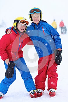 Two boys enjoying winter ski vacation