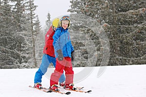 Two boys enjoying winter ski vacation