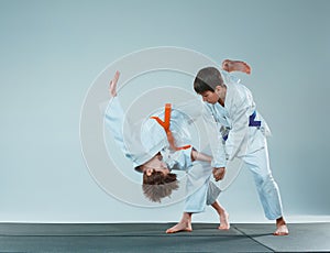 The two boys fighting at Aikido training in martial arts school. Healthy lifestyle and sports concept