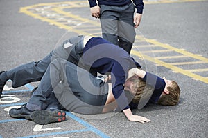 Two Boys Fighting In School Playground