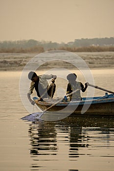 Two boys fishing in the Ganges