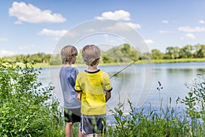 Two boys fishing on the lake