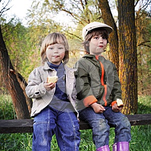 Two boys on the forest bench