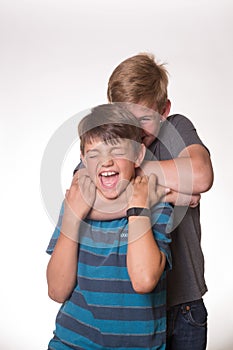 Two boys hugging/choking each other photo