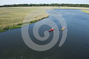 Two boys kayaking.