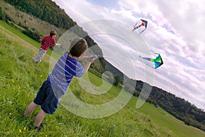 Two boys with kites.