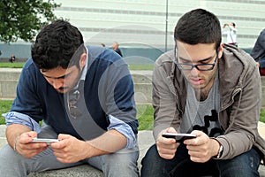 Two boys play with the phone