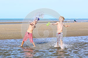 Two boys playing on the beach