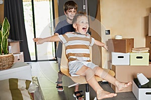 Two Boys Playing in New Home