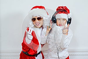 Two boys pretending he is a Bad Santa