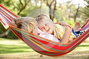 Two Boys Relaxing In Hammock