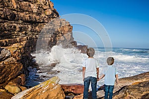 Two boys standing  on Cape of Good Hope