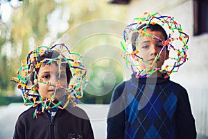 Two boys with strange helmets