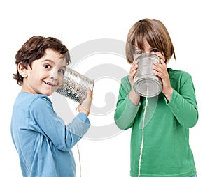 Two boys talking on a tin can phone