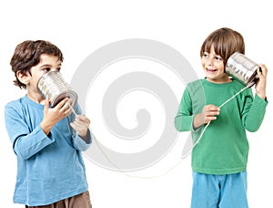 Two boys talking on a tin can phone