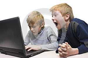Two boys use notebook
