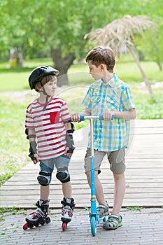 Two boys walk in city park