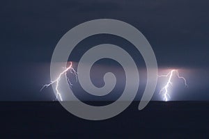 Two branched lightning strikes over the Adriatic Sea near the coast of Croatia